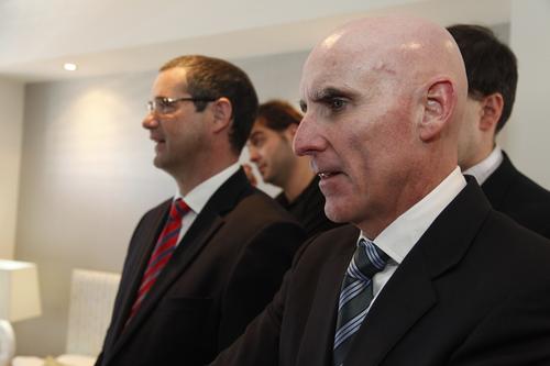 Former Alcatel-Lucent executive Mike Quigley (front right) is no longer at the helm of Australia's national broadband network (NBN) project.