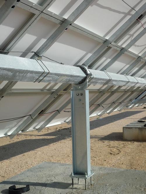 A custom-made part, shown in the middle of the photo, supports the movement of solar panels.  Source: igus