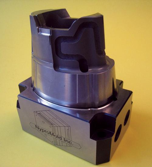 The top center area of the mold insert shows a section made with conformal cooling channels via a laser sintering process.