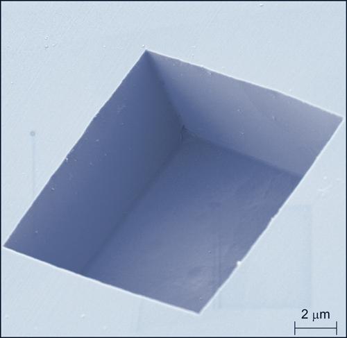 This image shows the box-like shape of a pit the NIST team etched into a diamond surface  and the pit's smooth vertical sidewalls and flat bottom.  (Photo courtesy of NIST.)