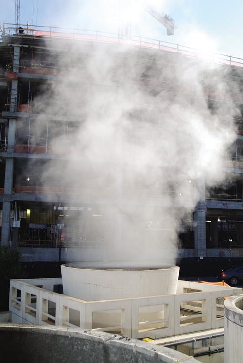 A cooling tower, like the one in this photo, is a structure that extracts waste heat from a process and distributes it to the atmosphere.

