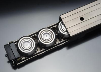 Unlike recirculating ball linear guides, Rollon's Compact Rail system utilizes large rolling elements that can pass over any debris that fall into the rail.