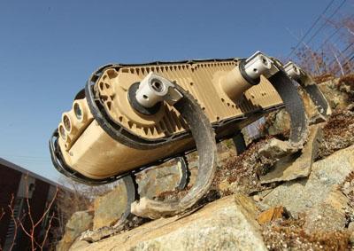 The six-legged RHex robot moves like a cockroach over a wide variety of rough terrain, and can climb telephone poles and stairs.   (Source: Boston Dynamics)
