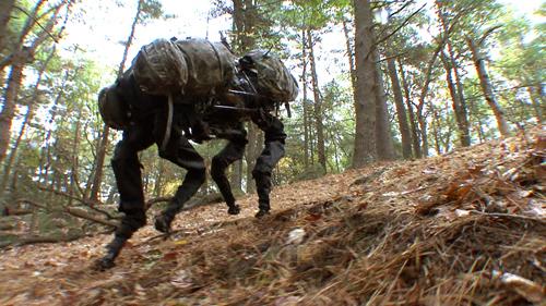 The Boston Dynamics BigDog is packed with sensors and powered by an engine that drives a hydraulic activation system. The robot is about three feet long and weighs 240 pounds. It can walk, run at 4mph, climb 35-degree slopes, and carry 340 pounds. The project is funded by DARPA's Tactical Technology Office. (Source: Boston Dynamics)
