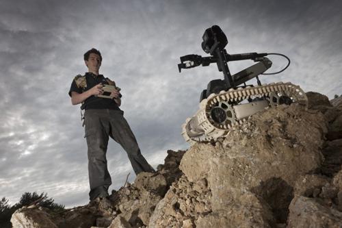 Originally designed for the US Marine Corps, QinetiQ's 20-pound Dragon Runner SUGV can be carried in a standard-issue pack. It allows users to see around corners and into tight spaces in urban environments, and it can be customized in the field. Its manipulator arm has a rotating shoulder, wrist, and fingers and can lift up to 10 pounds. Options include motion detectors, a microphone, pan/tilt/zoom cameras, day/night cameras, and extended radio frequency operation. (Source: QinetiQ)