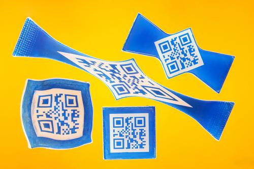 A new shape-memory plastic that makes QR code labels look like Salvador Dali's famous floppy watch could prove useful in product and brand protection. Since codes can be read only when the labels are in their permanent, original shape, labels can store information that makes products tough to counterfeit.   (Source: Bayer MaterialScience)
