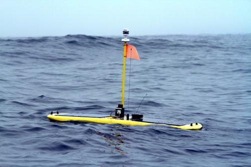 The solar-powered Wave Glider includes an acoustic receiver that tracks the location of sharks. Information from the tags is transmitted along a network of buoys in areas where sharks are known to congregate and connects to an iPhone/iPad app so users also can follow the sharks, as well as view interactive maps and information about them.   (Source: Stanford University)