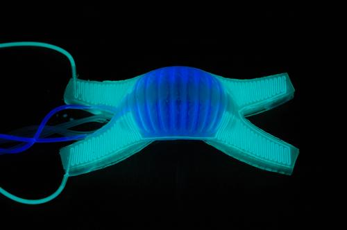 Low-cost silicone robots can walk, change color to match their surroundings, and light up in the dark, promising help for first responders and the military.   (Source: DARPA)