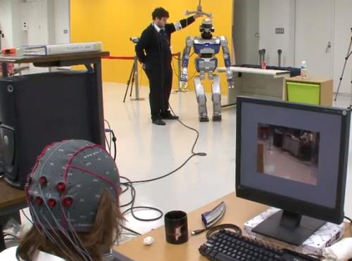 By focusing their attention on patterns created by flickering lights on a PC screen, which are associated with specific actions, users can control which actions they want a robot to perform, where the robot moves, and how it interacts with its environment.   (Source: CNRS-AIST Joint Robotics Laboratory)