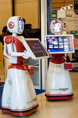 The FURO-Kis a friendly robotic kiosk. This bot moves about greeting people with a synthesized voice and explains its features. It is geared toward being a guide in public areas.  (Source: FURO)