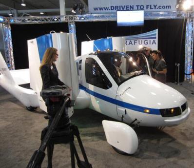 It's a car... It's an airplane... It's Terrafugia Transition. According to the company's site, 'The Transition combines the unique convenience of being able to fold its wings with the ability to drive on any road service in a modern personal airplane platform.' Sounds like a Pontiac Aztec with airfoils.

Hey, you gotta give Terrafugia props -- a pusher prop, in fact -- for trying. One of its advertising taglines is: 'Driven to Fly.' The other is: 'It's time to make the Transition.' That conversion will set you back $279,000. Not to worry. As the FAQ notes, 'the Transition provides a flexibility that cannot be matched with a separate car and airplane.' 

I think I speak for backseat drivers everywhere when I say, thanks, but I can walk to the curb from here.
