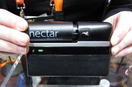Lilliputian Systems Inc. introduced a mobile power system at CES called Nectar, a charging device that leverages MEMS solid fuel cell technology. Nectar's butane fuel and high-efficiency solid oxide fuel cells provide high energy density. Butane is stored in a pod cartridge (left) and then inserted into the mobile power system. Capable of powering consumer devices for more than two weeks, the system charges smartphones, e-readers, and digital cameras that comply with USB 2.0. According to the company, aviation regulators will allow Nectar to be stowed in carry-on bags.