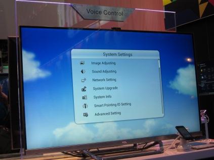 Smart TV is prompting the electronics industry to rethink remotes and the TV user interface. Natural User Interface, which includes voice control, recognition, and gestures, will be a must, argues CEVA's CEO Gideon Wertheizer. Meanwhile, Conexant is leveraging its voice roots, offering chips running its noise reduction, echo cancellation, spherical beam-forming algorithms, enabling voice commands in a large room. Shown is a TCL flat-panel TV embedded with voice recognition capability.
