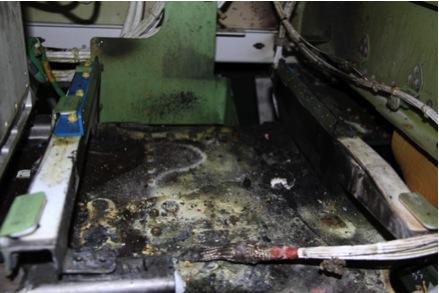 The auxiliary power unit (APU) battery area showed damage consistent with smoke, hot gases, and discharged electrolyte.   (Source: NTSB)
