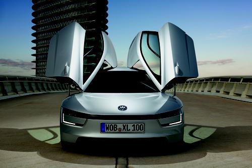 The XL1 follows sports car design principles -- low weight, low drag, and a low center of gravity. Its winged doors are made from carbon fiber-reinforced plastic.   (Source: Volkswagen AG)