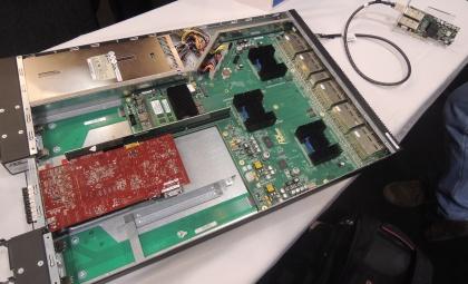The developer's system shown at the PCI SIG event still requires a full network interface card on each server.
