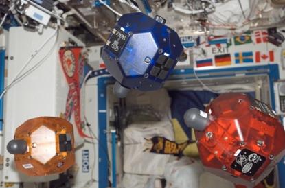 Three satellites fly in formation as part of the Synchronized Position Hold, Engage, Reorient, Experimental Satellites (SPHERES) investigation. This image was taken during Expedition 14 in the Destiny laboratory module. Source: NASA.