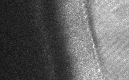 MIIM devices have four layers, (left to right) amorphous zirconium, hafnium oxide, aluminum oxide and aluminum, shown here in a transmission electron microscope (TEM) image.
(Source: Oregon State University)