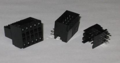 Figure 8. Samples of B2L and S2L double-decker plugs and sockets. The screwdriver is inserted into the rectangular slot on the socket on the left to release the spring clamp. The stripped wire is then inserted into the associated hole along the outer edge. (Click here to see a larger image.)