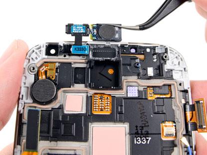 iFixit finds the 'multi-purpose component that connects the earpiece speaker, IR blaster, and a sensor array hosting the ambient light sensor and a second IR sensor.' Click here for larger image.(Source: iFixit)