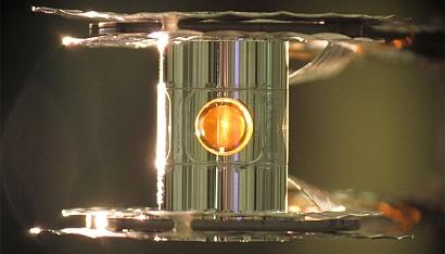 This metallic case holds the fuel capsule for the National Ignition Facility fusion experiments. The target is precisely positioned and cooled to cryogenic temperatures (18 kelvins, or -427°F) so that a fusion reaction is more easily achieved. (Photo by Eduard Dewald/LLNL)