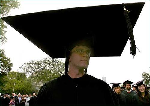 An MIT graduation ceremony, 2006, from Boston.com: 'Another graduate, Ryan Griffin, was prepared in case graduating gave him a big head.' (Globe Staff Photo / David L. Ryan)