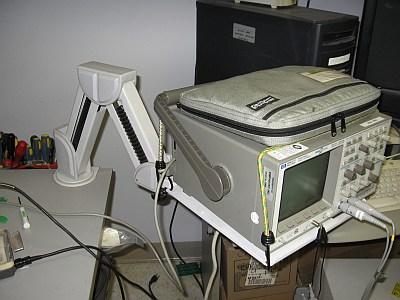 Aubrey Kagan used this computer monitor arm to hold his oscilloscope in 1998.