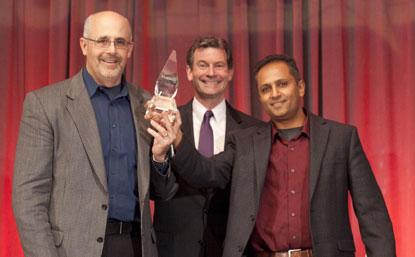 (Left to right): a Micron representative; Greg Waters, CEO of IDT (award sponsor); and Manish Deo, product marketing manage, Altera. Altera/Micron won ACE award for Design Team of Year.