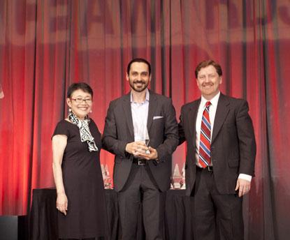 Kamal Khouri from AMD Embedded Solutions accepting award for AMD's Lisa Siu, senior VP and GM, Global Business Units.
