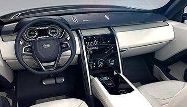 In the Discovery Vision's cockpit, the wheel features OLED touchscreens that control the infotainment system, lights, and signals. Instruments appear on a 3 million-pixel high-res screen. One rotary controls gears, and the other detaches to become a remote control.