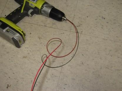 The unruly wires are inserted into the drill chuck, and the chuck is tightened. (Click here for a larger image.)
