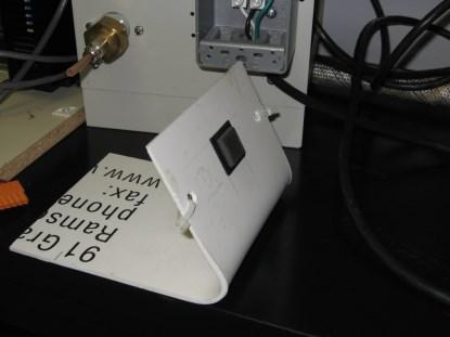 With the judicious use of a heat shrink gun (or paint heat stripper), it is possible to bend the sheet into a more convenient shape.(Click here for a larger image.)