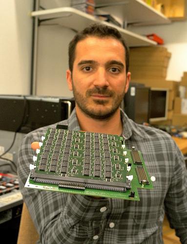 Ioannis Koltsidas, an IBM storage systems research staff member, shows his prototype board that outperforms flash alone by addingphase change memory (PCM).(Source: IBM)