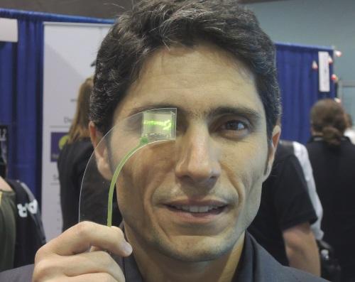 Ivo Yves Vieira, chief executive of LusoSpace (Lisbon) a satellite electronics maker, shows Lisplay, a proof of concept for an 800x600 pixel headset. The company is seeking $2 million to make a full color active-matrix version of its monochrome, passive OLED.
