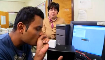 Perena Gouma watches as a student demonstrates the breathalyzer. (Source: National Science Foundation)
