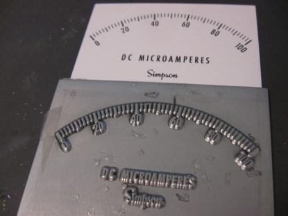 Here's an example of a zinc offset press plate and the corresponding faceplate. I have actually seen these used. (Click here for a larger image.)