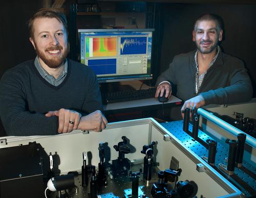 Postdoctoral fellow Erik Busby and Matt Sfeir with optical equipment they used to study charge carrier production in organic photovoltaic polymers at Brookhaven Lab's Center for Functional Nanomaterials.
(Source: Brookhaven National Labs)