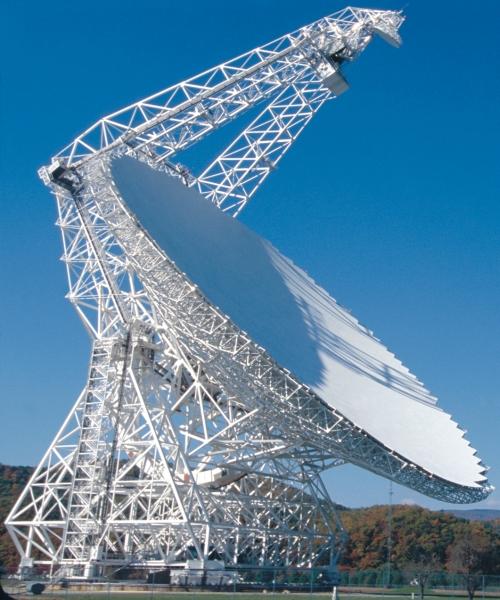 The Green Bank Telescope is 485 feet (148 meters) high. It weighs 17 million pounds (7700 metric tonnes) with a dish area of 2.3 acres (1.7 hectares). It is the largest moving structure on land, and the largest fully-steerable telescope in the world (photo provided by NRAO).