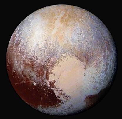 Four images from New Horizons' Long Range Reconnaissance Imager (LORRI) were combined with color data from the Ralph instrument to create this enhanced color global view of Pluto (Photo: NASA).