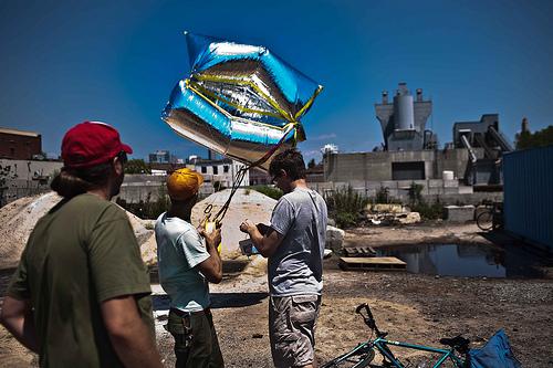 Using a weather balloon to map the effluent in the Gowanus Canal in Brooklyn, NY.  

(Credit: Liz Barry, Gowanus Conservancy.) 