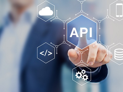 A person clicking a button showing the word "API" connected to many parts of life, representing the importance of asking the question, "What is API Documentation?"