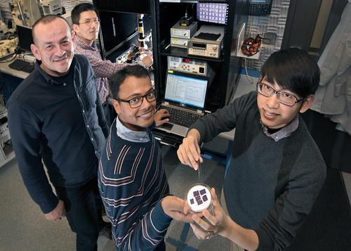 Research team showing off their quantum-dot doped nanomaterial (back to front: Chang-Yong Nam and Mircea Cotlet of Brookhaven Lab's Center for Functional Nanomaterials with Stony Brook University graduate students Prahlad Routh and Jia-Shiang Chen).
(Source: Brookhaven) 